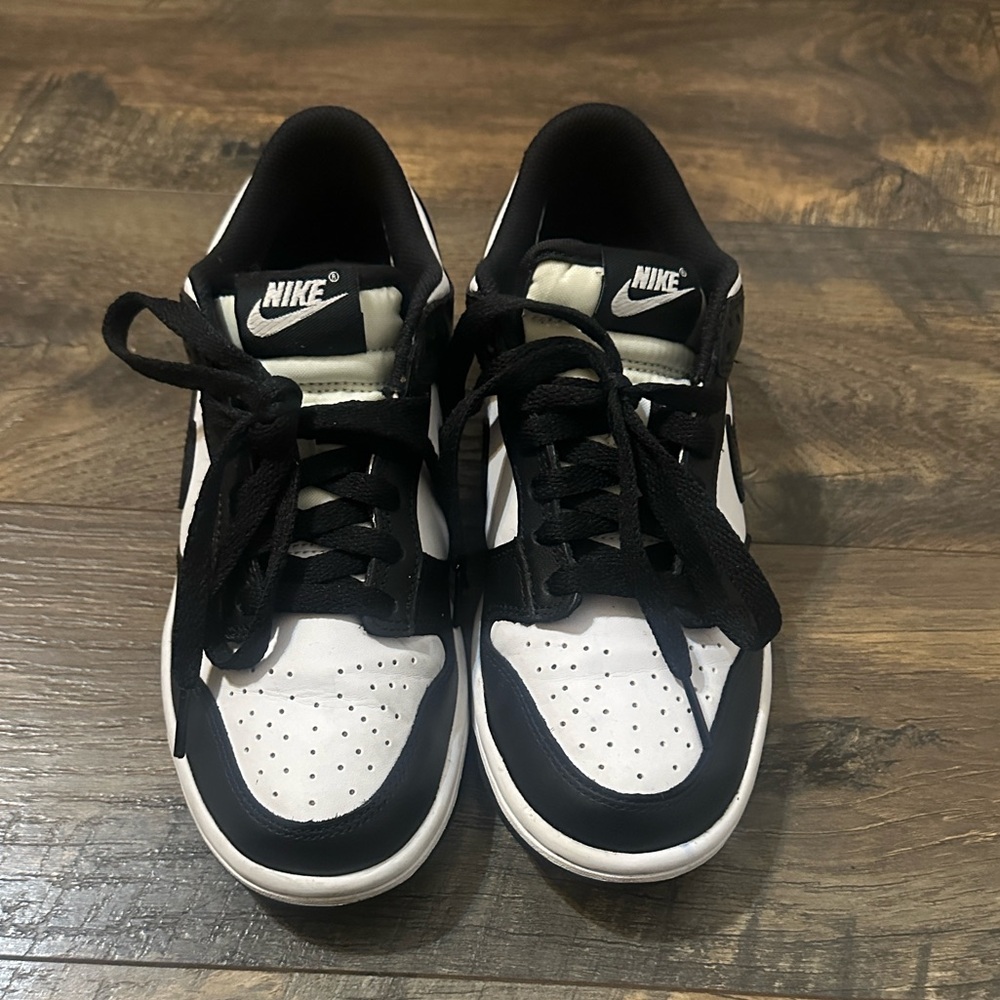 Nike Dunk Low in the popular "Panda" (white and black) colorway size 4.5